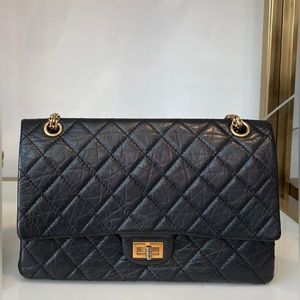 Chanel 2.55 handbag black gold